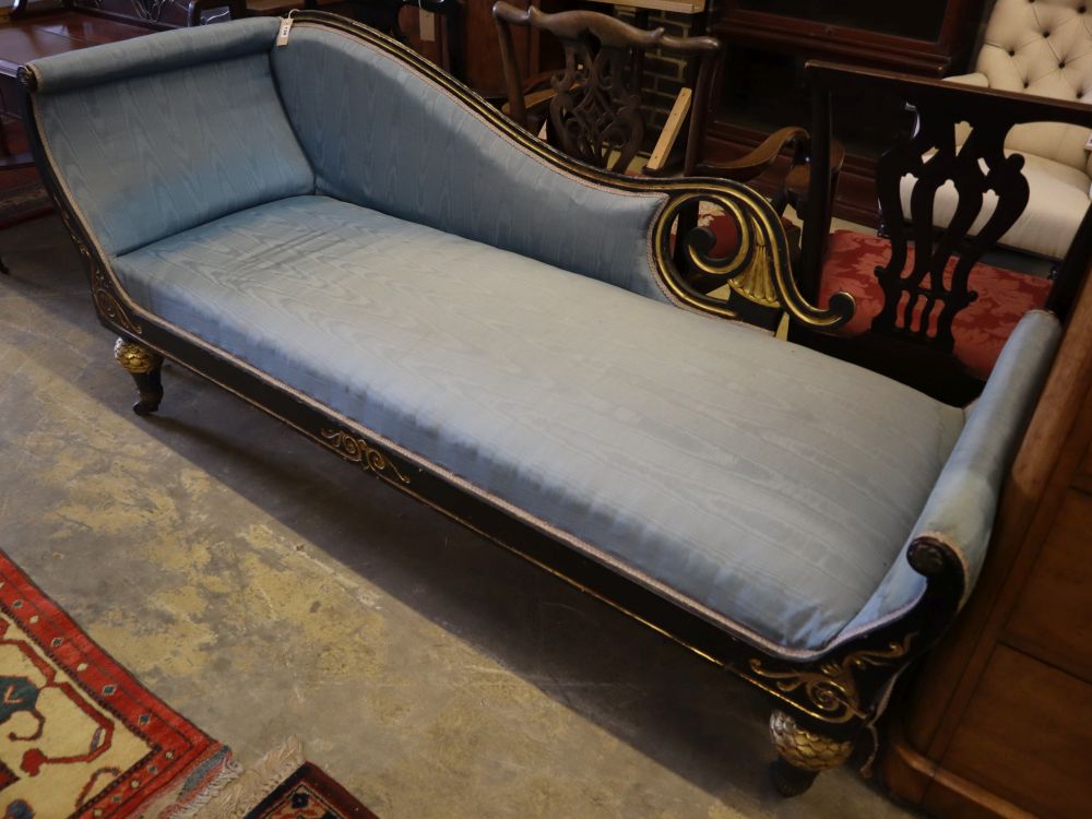 A William IV gilt and ebonised chaise longue, width 200cm, depth 69cm, height 84cm